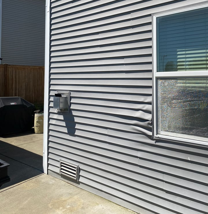 Warped-vinyl-siding