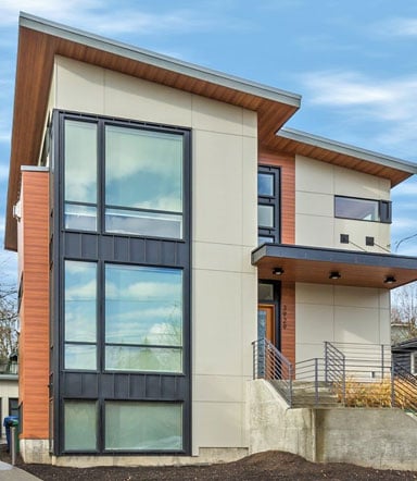 Modern house with James Hardie panel siding and large windows