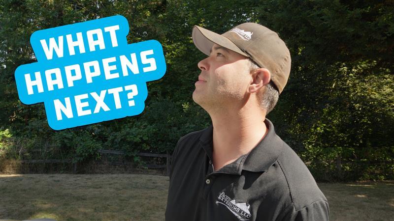 Man in hat looking upwards, text says 