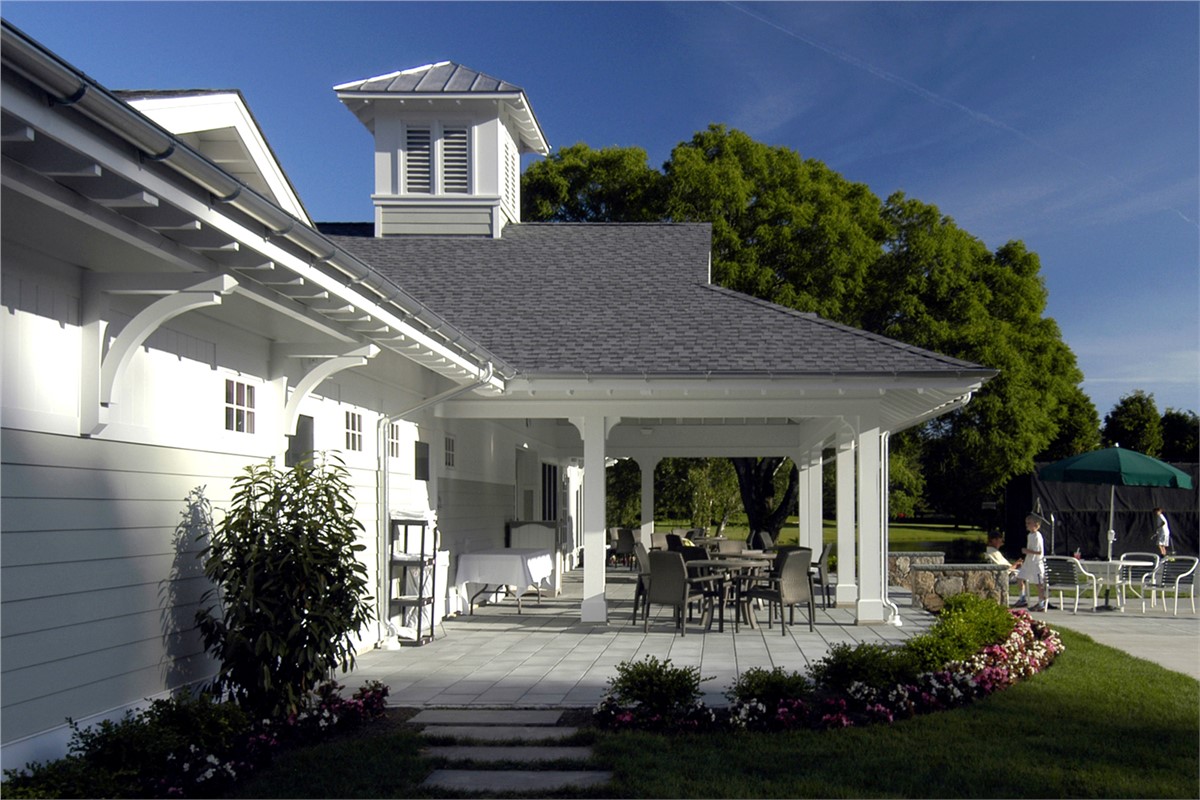 White James Hardie siding with asphalt shingles in a gathering area.