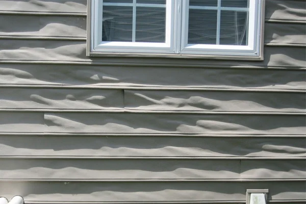Warped-vinyl-siding