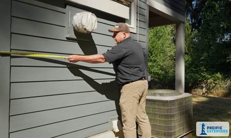 Measuring-siding-on-home