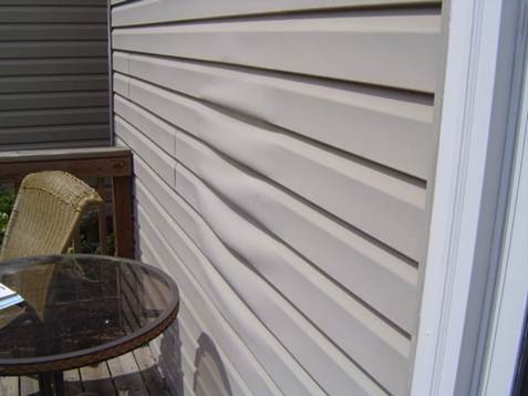 Warped-vinyl-siding